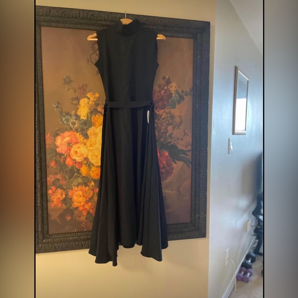 New with tag black designer dress flare bottom fit in waist size m